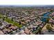 Aerial view of a large planned community with ponds and green spaces at 897 E Cherry Hills Dr, Chandler, AZ 85249