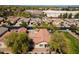 Aerial view of homes with red tile roofs and desert landscaping in a suburban neighborhood at 897 E Cherry Hills Dr, Chandler, AZ 85249