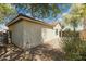 View of the back corner of this home featuring a neutral stucco exterior, a tiled roof, and minimal landscaping at 897 E Cherry Hills Dr, Chandler, AZ 85249