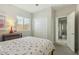 Bright bedroom with cherry-themed accents, neutral walls, and a convenient closet at 897 E Cherry Hills Dr, Chandler, AZ 85249
