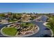 Welcoming community entrance featuring manicured landscaping, an American flag, and a gated entry at 897 E Cherry Hills Dr, Chandler, AZ 85249