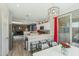 Open layout connecting kitchen and dining area, stainless steel appliances, and bright natural light at 897 E Cherry Hills Dr, Chandler, AZ 85249