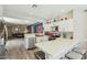 Bright kitchen features white cabinets, stainless steel appliances, and quartz countertops with seating at 897 E Cherry Hills Dr, Chandler, AZ 85249