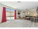 Spacious living room with wood floors, a large window, and an open layout perfect for relaxing and entertaining at 897 E Cherry Hills Dr, Chandler, AZ 85249