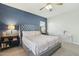 Comfortable main bedroom with a blue accent wall, upholstered headboard, and side tables at 897 E Cherry Hills Dr, Chandler, AZ 85249