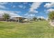 Community park with playground structure, green grass and clear blue skies with puffy clouds at 897 E Cherry Hills Dr, Chandler, AZ 85249