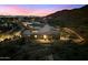 Dusk aerial view of the property, with views of the surrounding desert landscape and city lights at 9539 S 13Th Way, Phoenix, AZ 85042