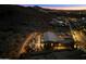 Night aerial view showcasing a cozy outdoor entertainment area with a fire pit at 9539 S 13Th Way, Phoenix, AZ 85042