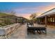 Beautiful back patio with mountain views, fire pit, and comfortable seating areas at 9539 S 13Th Way, Phoenix, AZ 85042