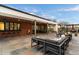 Expansive back patio featuring a bar, multiple seating areas, and an outdoor fireplace at 9539 S 13Th Way, Phoenix, AZ 85042