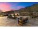 Outdoor living area featuring desert landscaping, fire pit, BBQ, and mountain views at 9539 S 13Th Way, Phoenix, AZ 85042