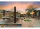 Cozy backyard featuring a hammock, desert landscaping, and scenic desert views at 9539 S 13Th Way, Phoenix, AZ 85042