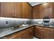 Stylish bar area featuring custom cabinets, elegant countertops, and modern fixtures at 9539 S 13Th Way, Phoenix, AZ 85042