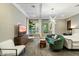 Cozy bedroom featuring a sitting area, large windows, and designer lighting at 9539 S 13Th Way, Phoenix, AZ 85042
