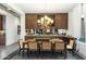 Elegant dining room with custom cabinetry, mirrored backsplash and designer light fixture at 9539 S 13Th Way, Phoenix, AZ 85042