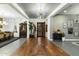 Spacious foyer featuring hardwood floors and modern lighting at 9539 S 13Th Way, Phoenix, AZ 85042