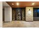 Grand front entrance featuring custom iron gate and stonework at 9539 S 13Th Way, Phoenix, AZ 85042