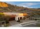 Front exterior showcasing desert landscaping and views of the McDowell Mountains at 9539 S 13Th Way, Phoenix, AZ 85042