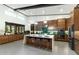 Gourmet kitchen with large island, stainless steel appliances, and custom cabinetry at 9539 S 13Th Way, Phoenix, AZ 85042