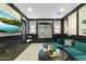 Modern living room with built-in storage, comfortable seating, and a large-screen TV at 9539 S 13Th Way, Phoenix, AZ 85042