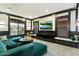 A stylish living room space with a sectional sofa, media console, and window views at 9539 S 13Th Way, Phoenix, AZ 85042