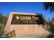 Stone monument sign at the entrance to Legend Trail, a golf community at 9586 E Chuckwagon Ln, Scottsdale, AZ 85262