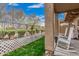 Well-maintained backyard featuring green grass and charming landscaping at 1350 S Greenfield Rd # 1225, Mesa, AZ 85206