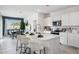 Modern kitchen with white cabinets, a center island, and stainless steel appliances at 1399 S 239Th Dr, Buckeye, AZ 85326