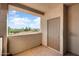 Private balcony with a storage room door and scenic neighborhood views at 14000 N 94Th St # 3094, Scottsdale, AZ 85260