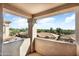 Balcony view showcasing the neighborhood's desert landscaping and bright blue skies at 14000 N 94Th St # 3094, Scottsdale, AZ 85260