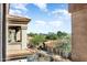 Rooftop view framing tile roofs and desert foliage against a backdrop of mountains at 14000 N 94Th St # 3094, Scottsdale, AZ 85260