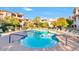 Inviting community pool with plenty of lounge chairs and lush landscaping at 14000 N 94Th St # 3094, Scottsdale, AZ 85260