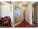 Bathroom featuring a glass shower, a dark wood desk, light wood cabinets, and beautiful wood floors at 14442 W Lexington Ave, Goodyear, AZ 85395