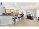 Eat-in kitchen with granite countertops, stainless steel appliances and a breakfast bar at 14442 W Lexington Ave, Goodyear, AZ 85395