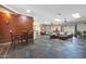 Spacious living room with slate floors, skylights and comfortable seating perfect for relaxing and socializing at 14442 W Lexington Ave, Goodyear, AZ 85395