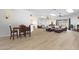 Open-concept living area boasts wood floors, skylights, fireplace, and comfortable seating at 14442 W Lexington Ave, Goodyear, AZ 85395