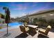 Exterior patio featuring a fire pit and a view of the pool at 14442 W Lexington Ave, Goodyear, AZ 85395