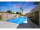 Backyard featuring a pool and desert landscaping at 14442 W Lexington Ave, Goodyear, AZ 85395