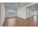 Spacious living room with a large window and wood-look tile flooring at 14761 W Tether Trl, Surprise, AZ 85387