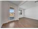 Bright living room with wood-look tile flooring and lots of natural light at 14761 W Tether Trl, Surprise, AZ 85387