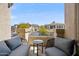 Balcony with comfortable seating and views of the neighborhood and distant mountains at 16420 N Thompson Peak Pkwy # 2091, Scottsdale, AZ 85260