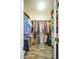 Walk-in closet with ample shelving and hanging space for clothing and accessories at 16420 N Thompson Peak Pkwy # 2091, Scottsdale, AZ 85260