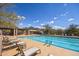 Relax and unwind at the beautiful community pool with mountain views and ample seating at 16420 N Thompson Peak Pkwy # 2091, Scottsdale, AZ 85260