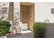 Inviting front entry featuring a modern door, stylish lighting, and desert landscaping at 16420 N Thompson Peak Pkwy # 2091, Scottsdale, AZ 85260