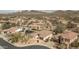 Beautiful aerial view of a home in a desert community showing the tile roof and the surrounding landscape at 1712 W Aloe Vera Dr, Phoenix, AZ 85085