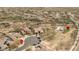 This aerial view shows a desert community with a community park, basketball court, and playground area at 1712 W Aloe Vera Dr, Phoenix, AZ 85085