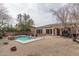 Expansive backyard with a pool, patio, and low-maintenance desert landscaping at 1712 W Aloe Vera Dr, Phoenix, AZ 85085