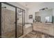 Luxurious bathroom featuring a glass shower, soaking tub, and double vanity at 1712 W Aloe Vera Dr, Phoenix, AZ 85085