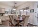 Traditional dining room features a wooden table and dark wood floors at 1712 W Aloe Vera Dr, Phoenix, AZ 85085