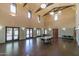 Large meeting room featuring bright natural light, high vaulted ceilings with exposed beams, and multiple exits for easy access at 1712 W Aloe Vera Dr, Phoenix, AZ 85085